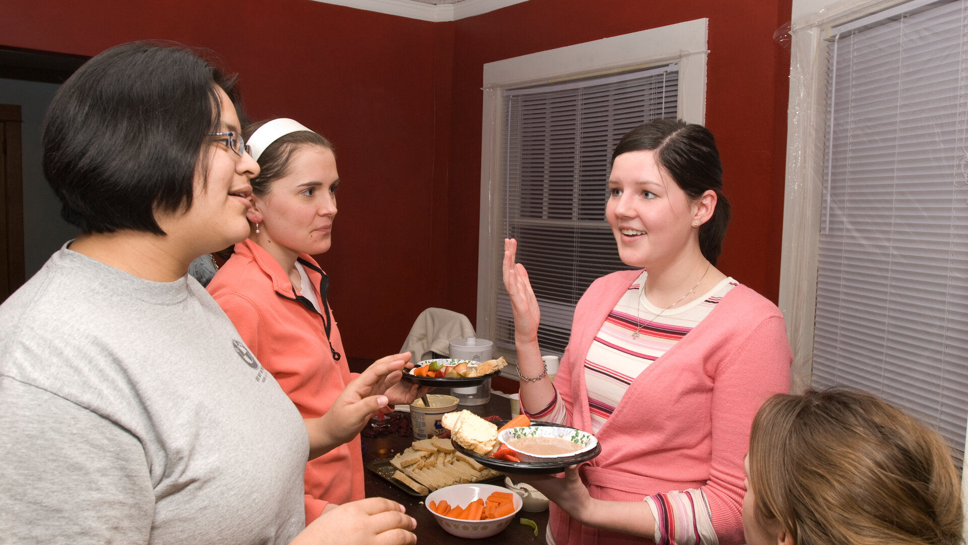 students eat dinner over conversation