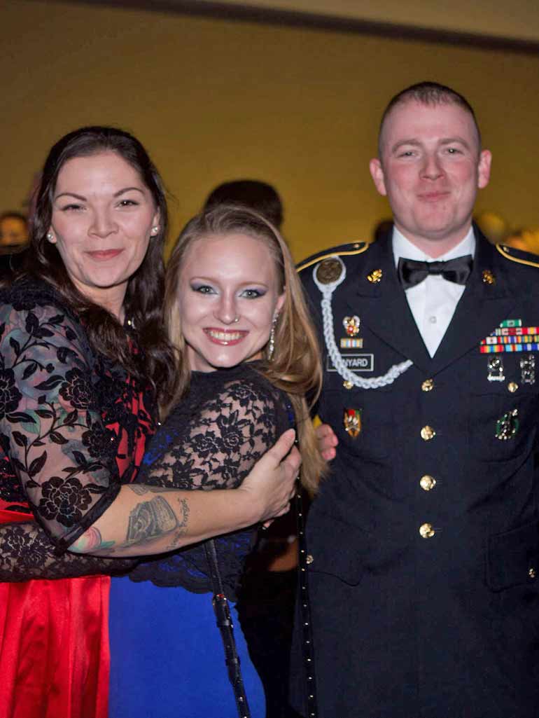 Veteran family smiling and posing at the annual Veterans Ball.