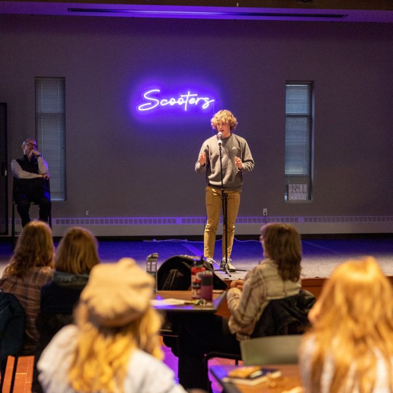 Student speaking at an event
