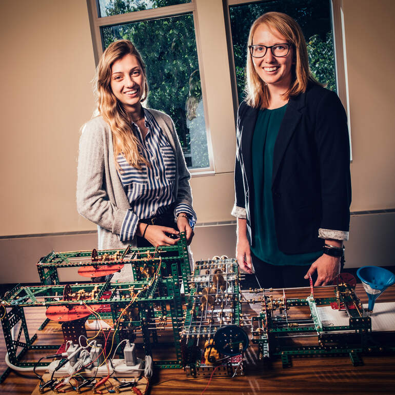 math professor and student with a differential analyzer used during a research project