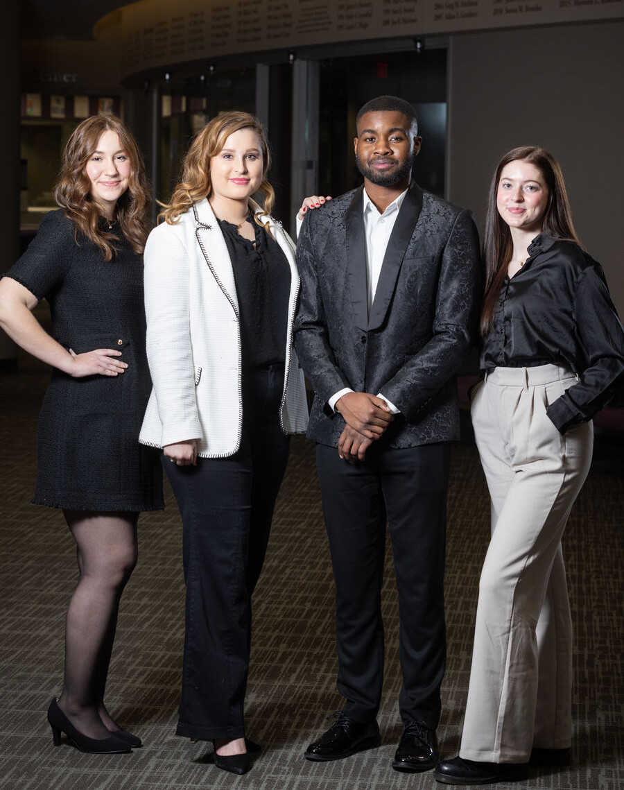Four Student Researchers Standing Together