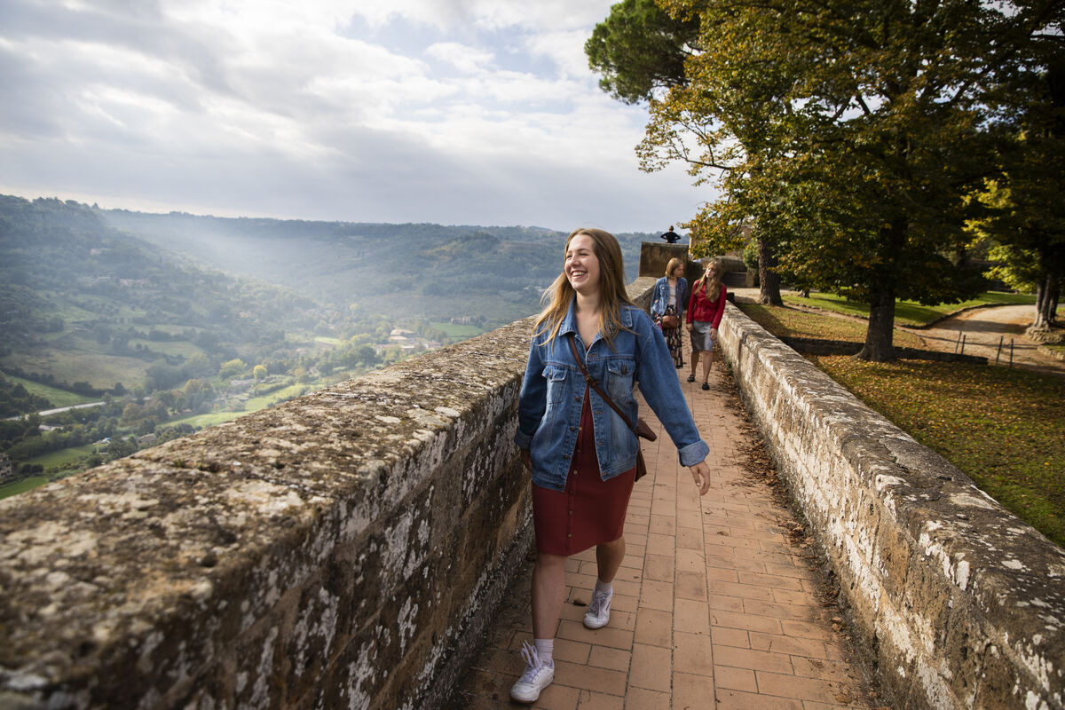 Student walking in Italian countryside.