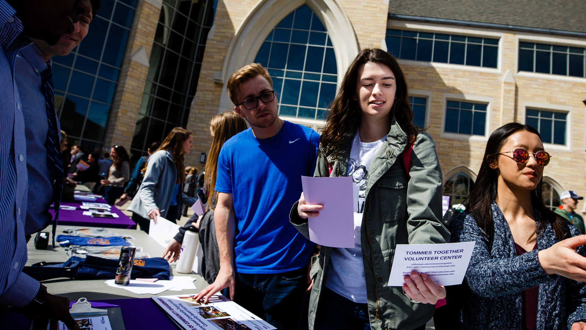 Students talk about registering to vote on the plaza