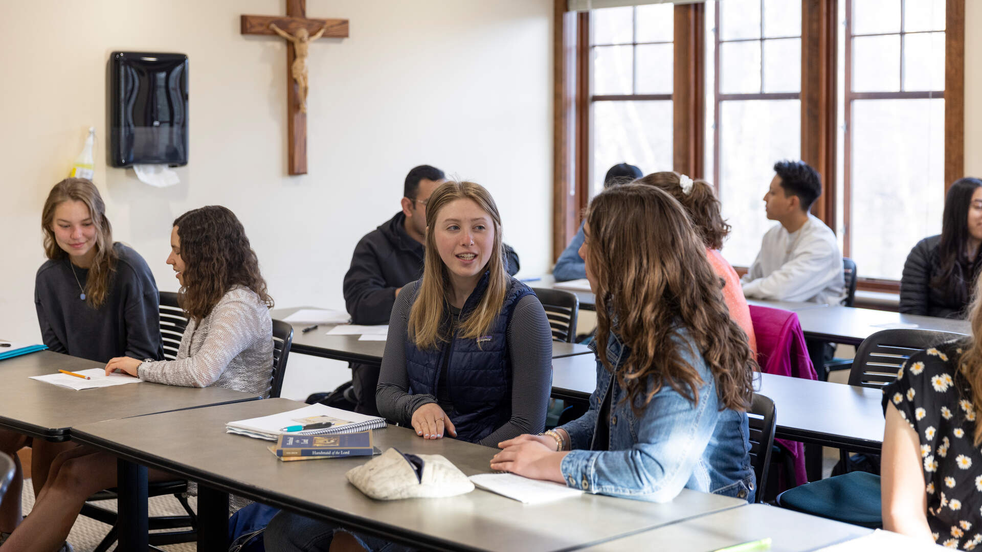 Students engaged in a classroom discussion during Catholic Studies course