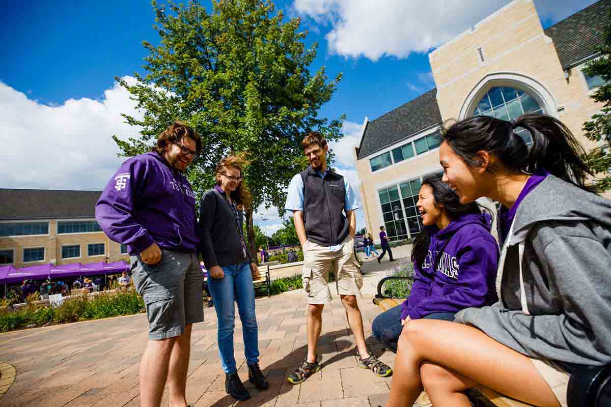 Students chat on the John P. Monahan Plaza.