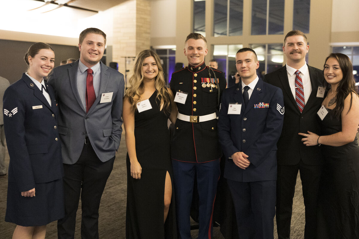 a group of veterans and their guests posing at the yearly veterans ball