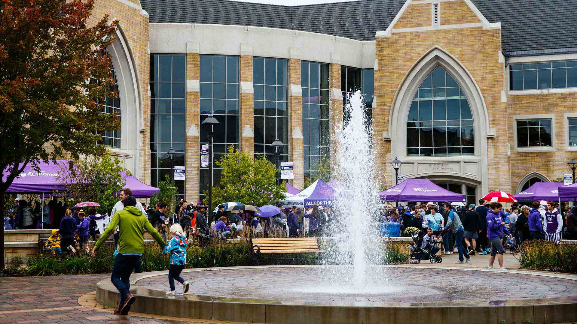 Guests outside during a homecoming Purple on the Plaza.