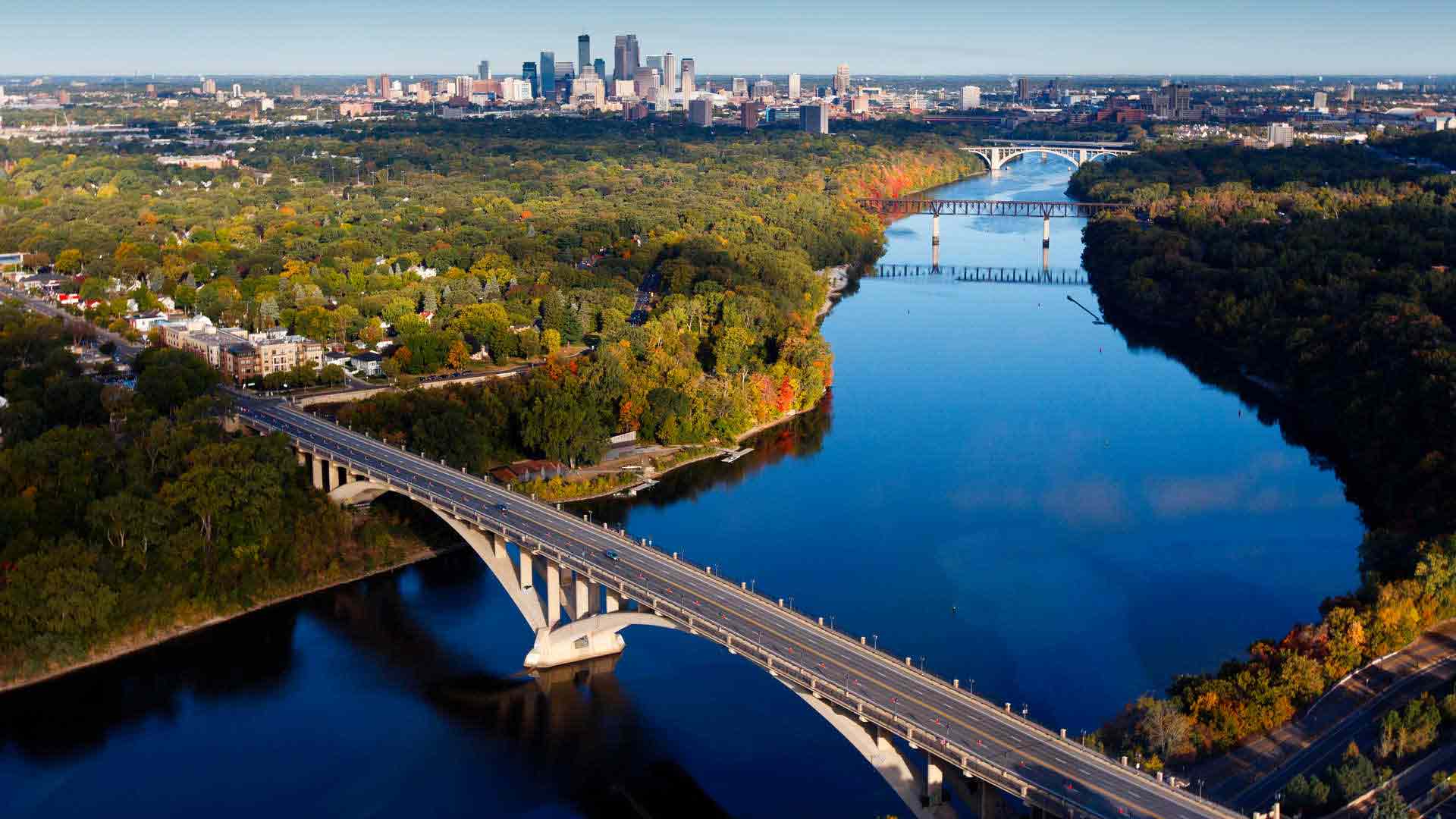 Aerial shot of the Mississippi river with downtown Minneapolis in background