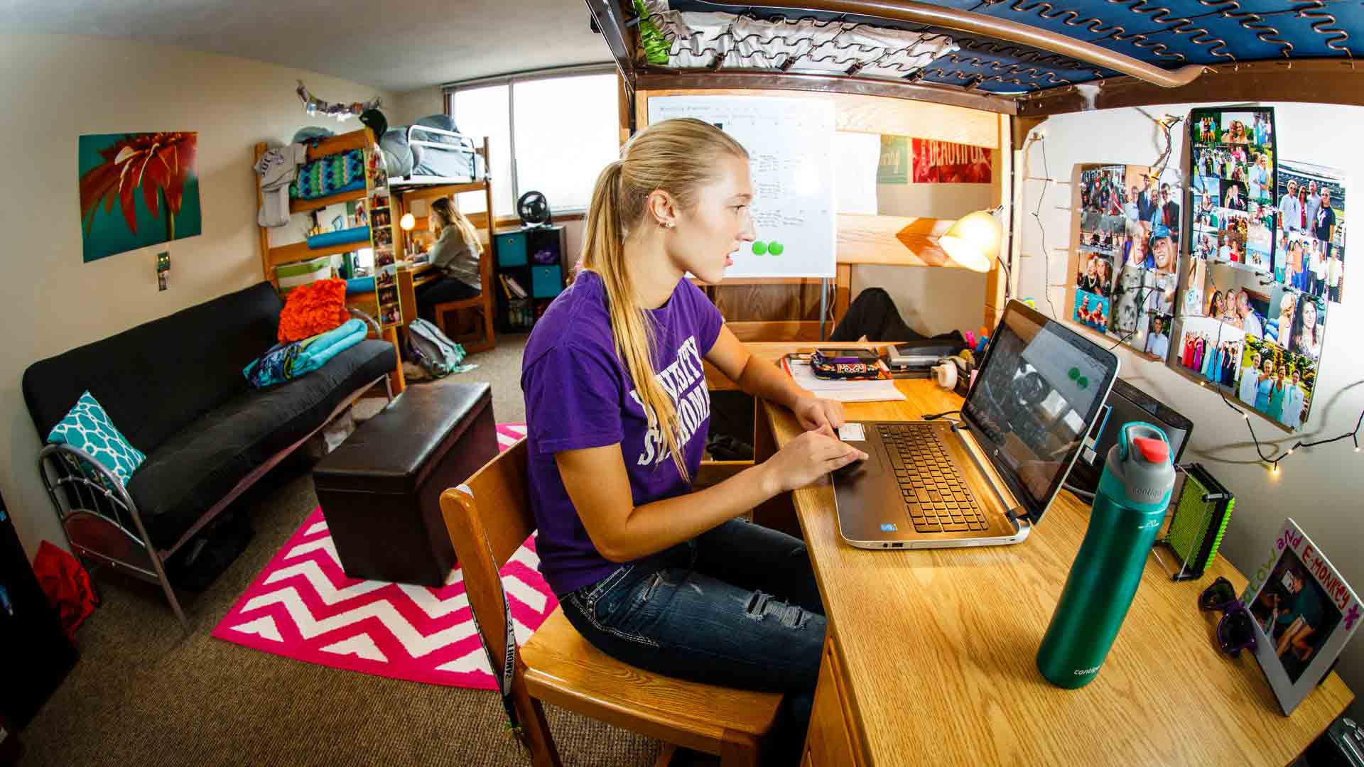St. Thomas students studies in her room in Murray Hall.