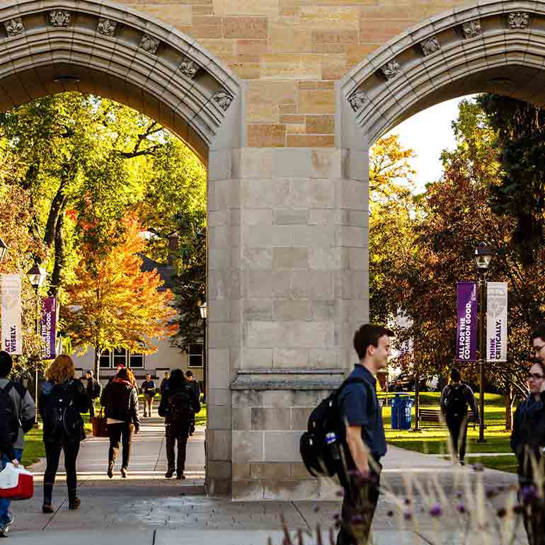 Students walk past and through The Arches.