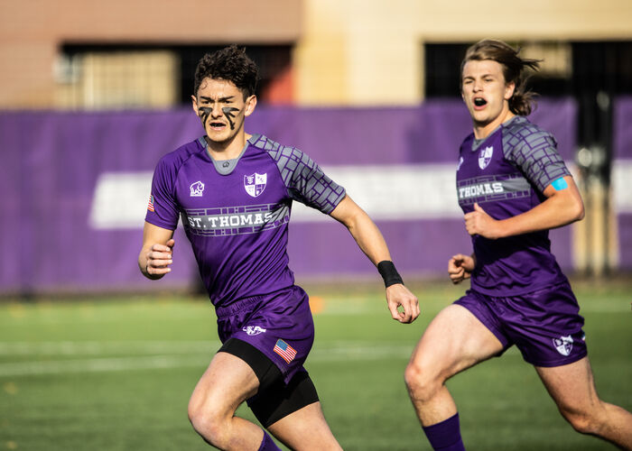 Soccer players running on the field