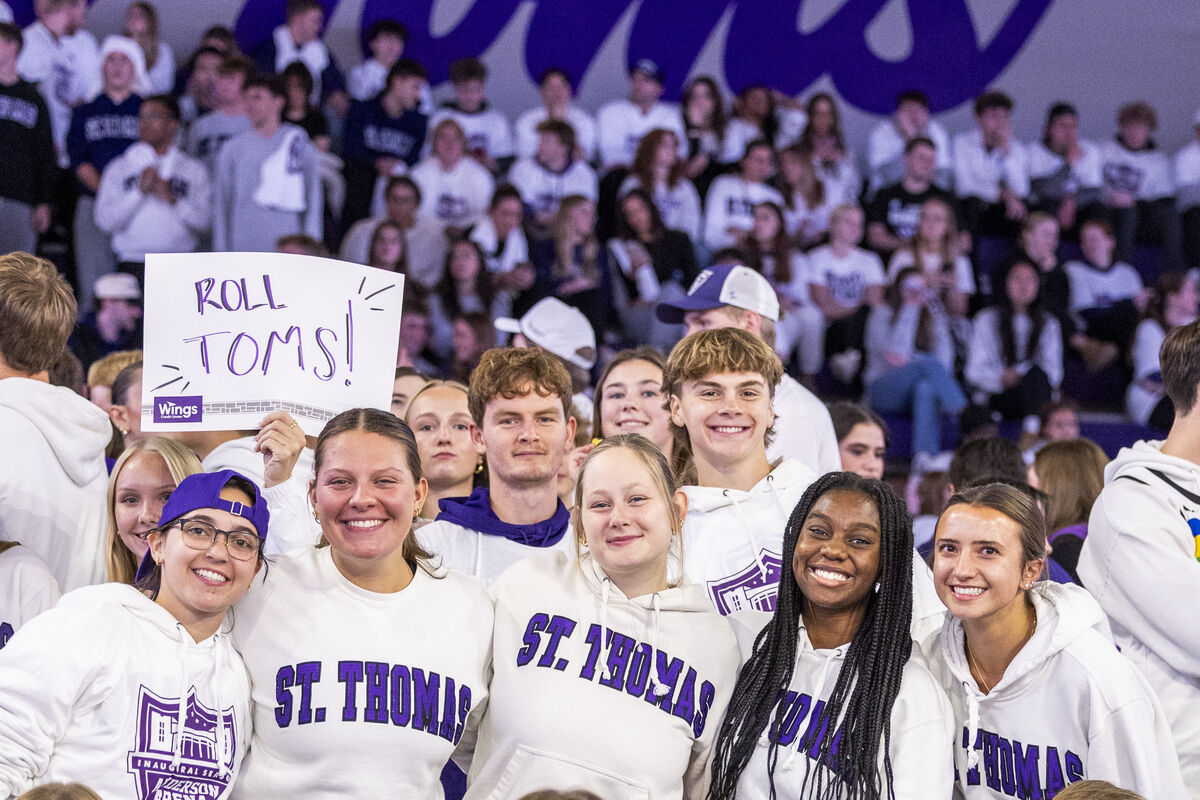 Students cheering at a basketball game