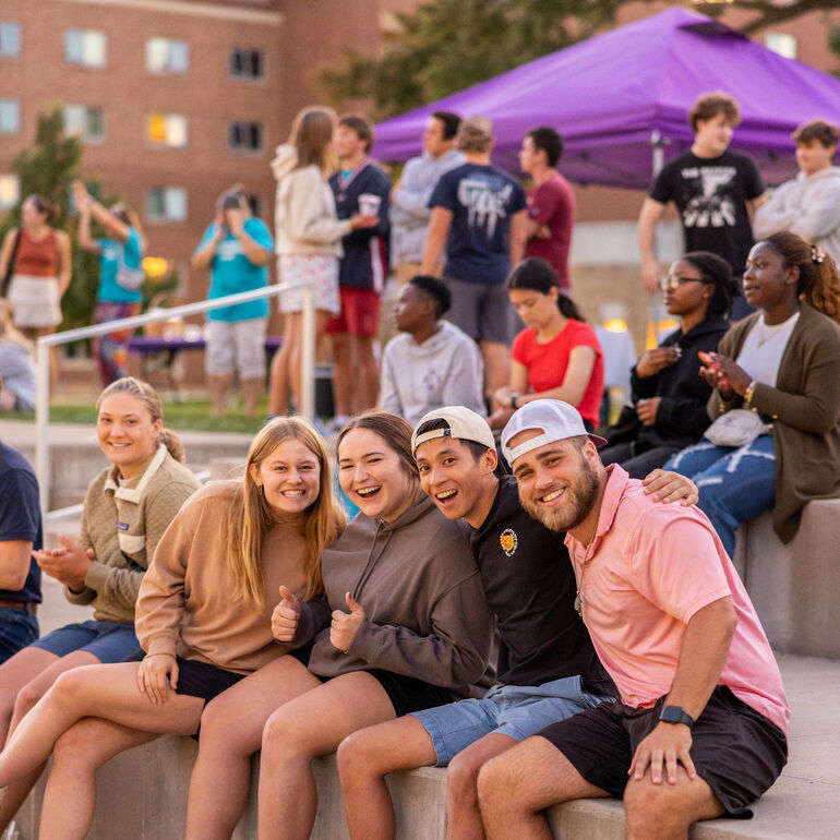 Students sitting and laughing together