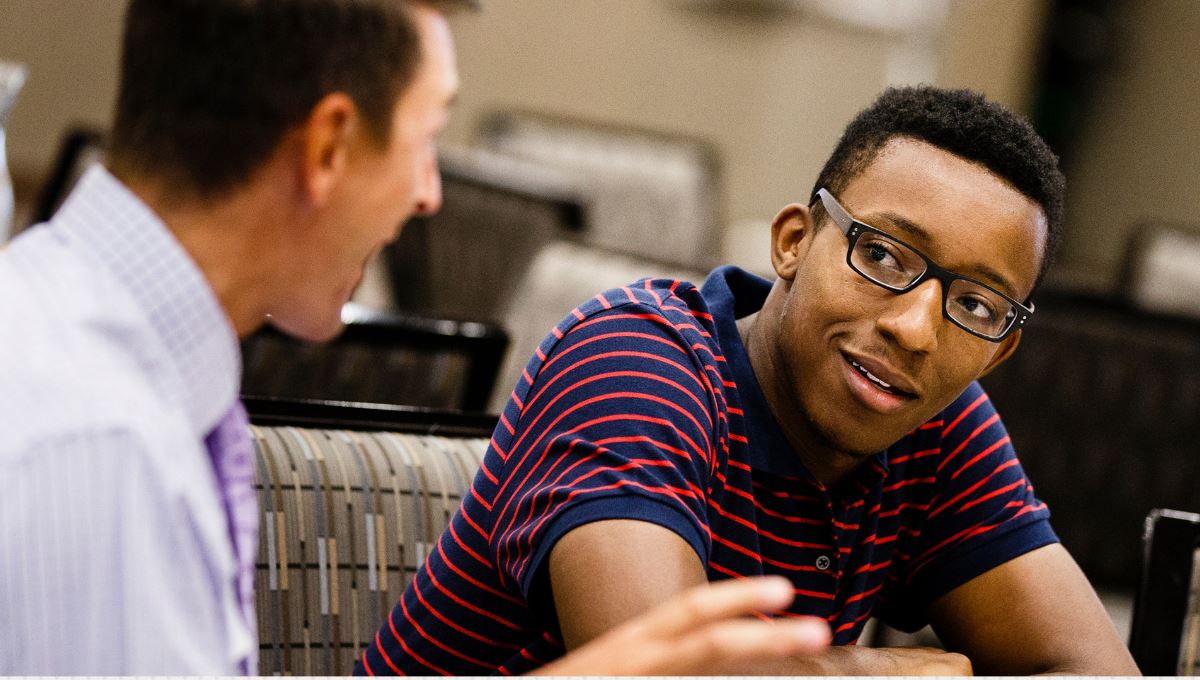 two people engaging in conversation 