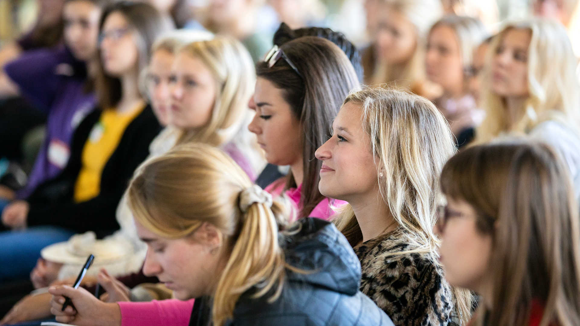 student listening to a speaker