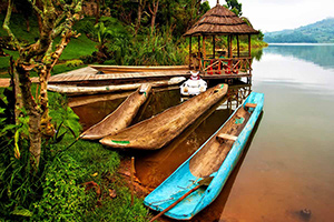 Cannoes moored on a river in the jungle.
