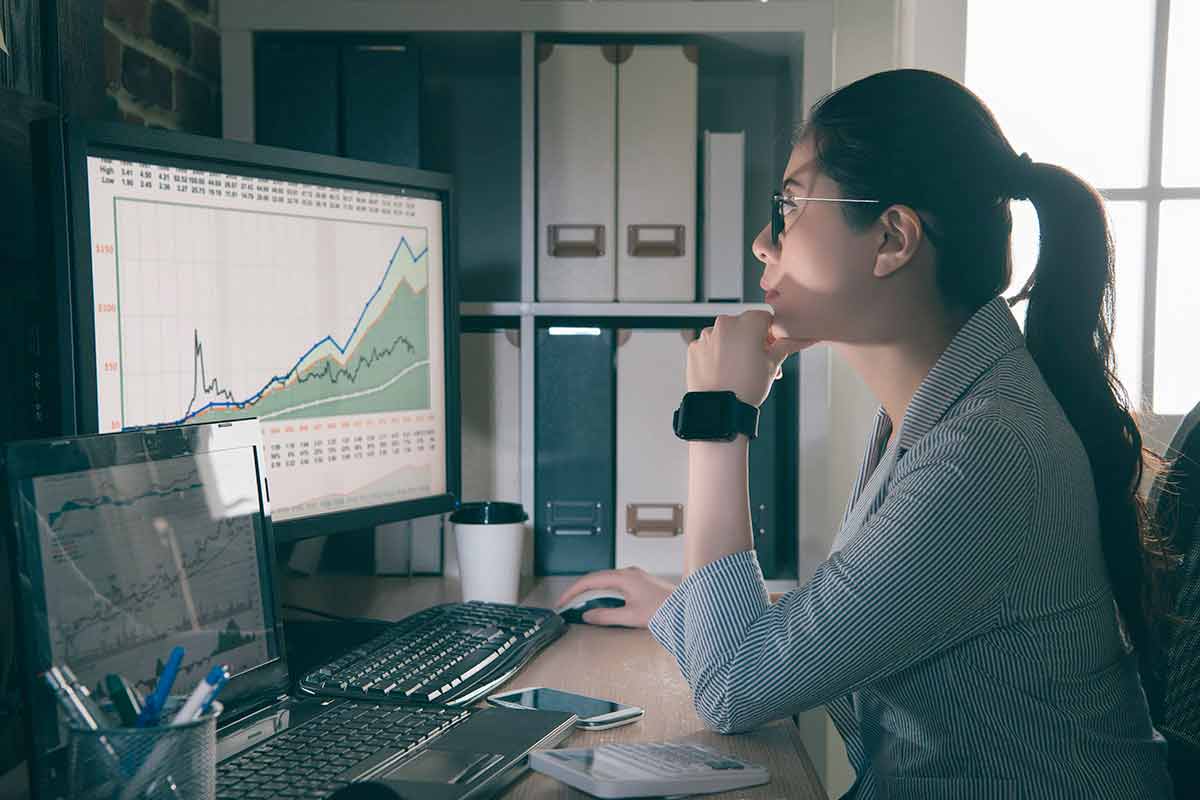 Woman analyzing data on a computer