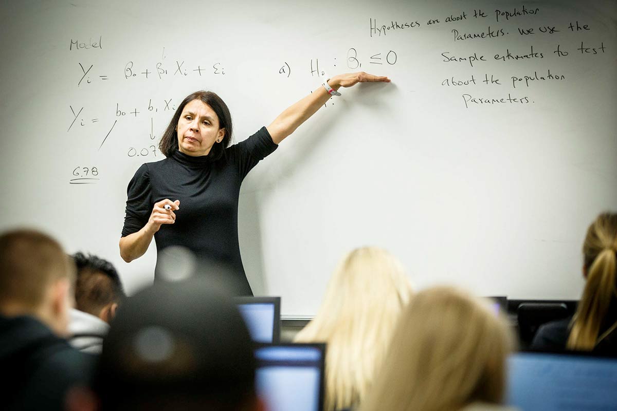 Professor Luz Saavdra teaches an Economics Forecasting Class in O'Shaughnessy Education Center.