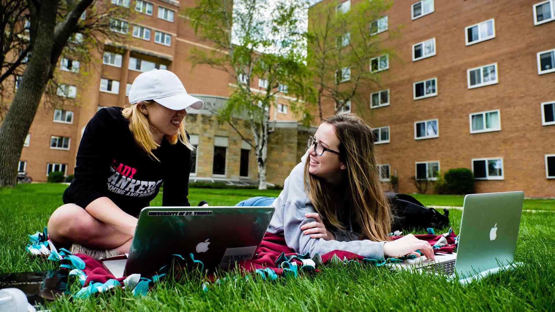 Rachel Armstrong (left, economics) and Larissa Ablutz (computer science) study together on the Upper Quad.