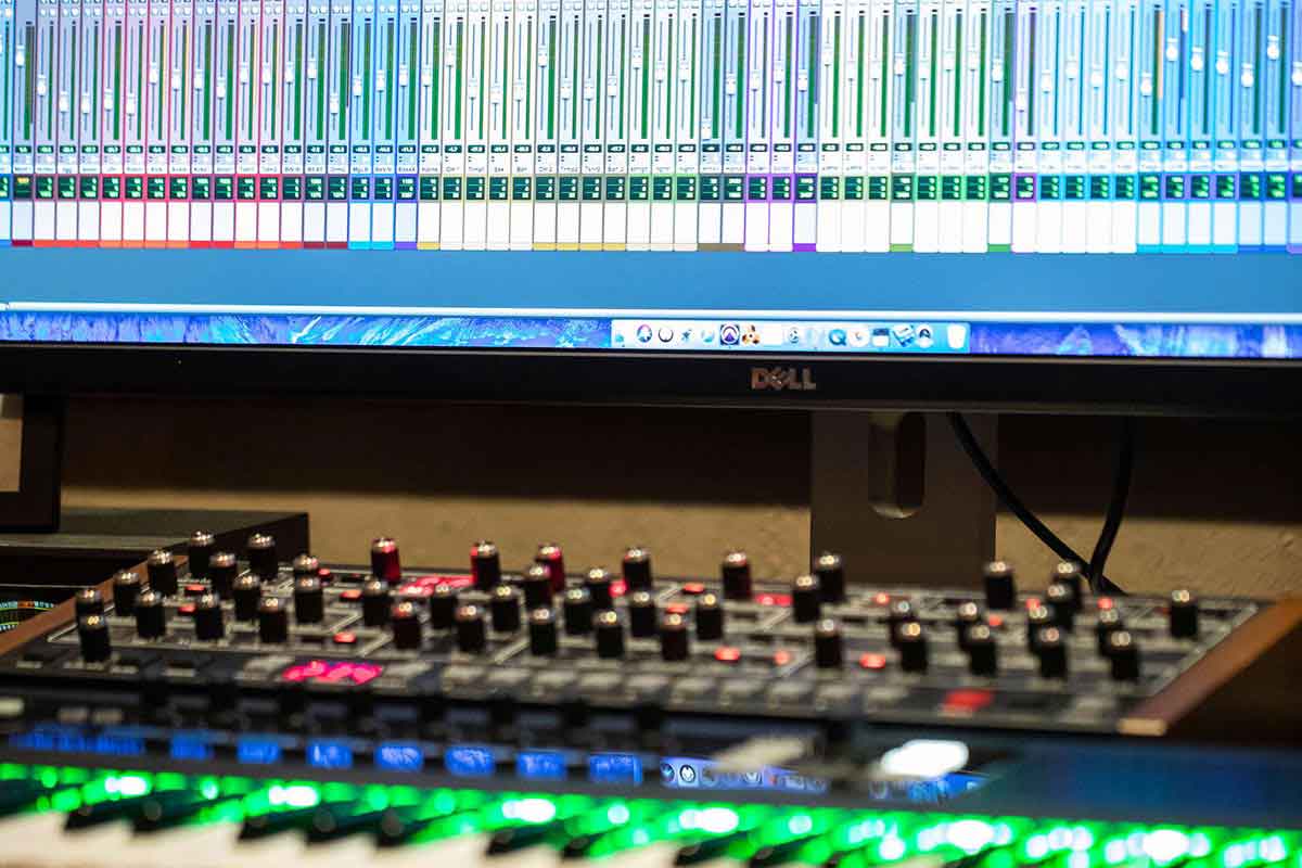 Music editing software and equipment in a studio.