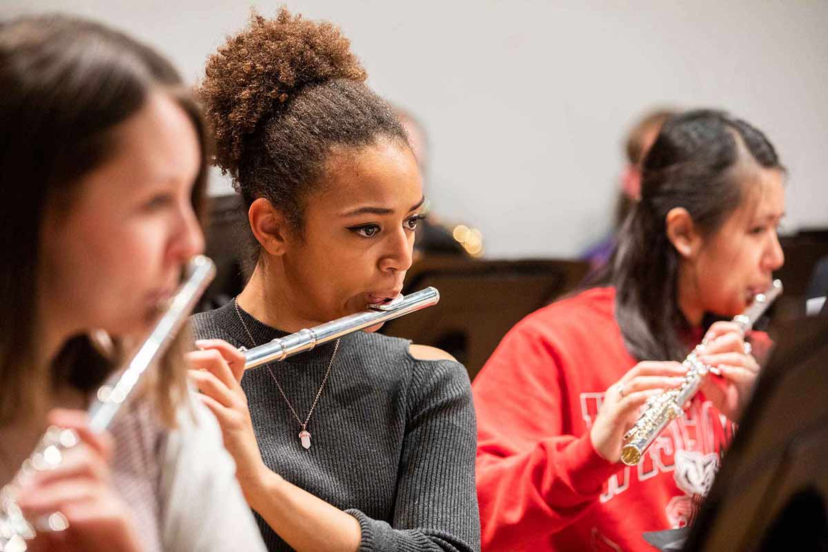 Flute players in the Symphonic Band ensemble rehearses.