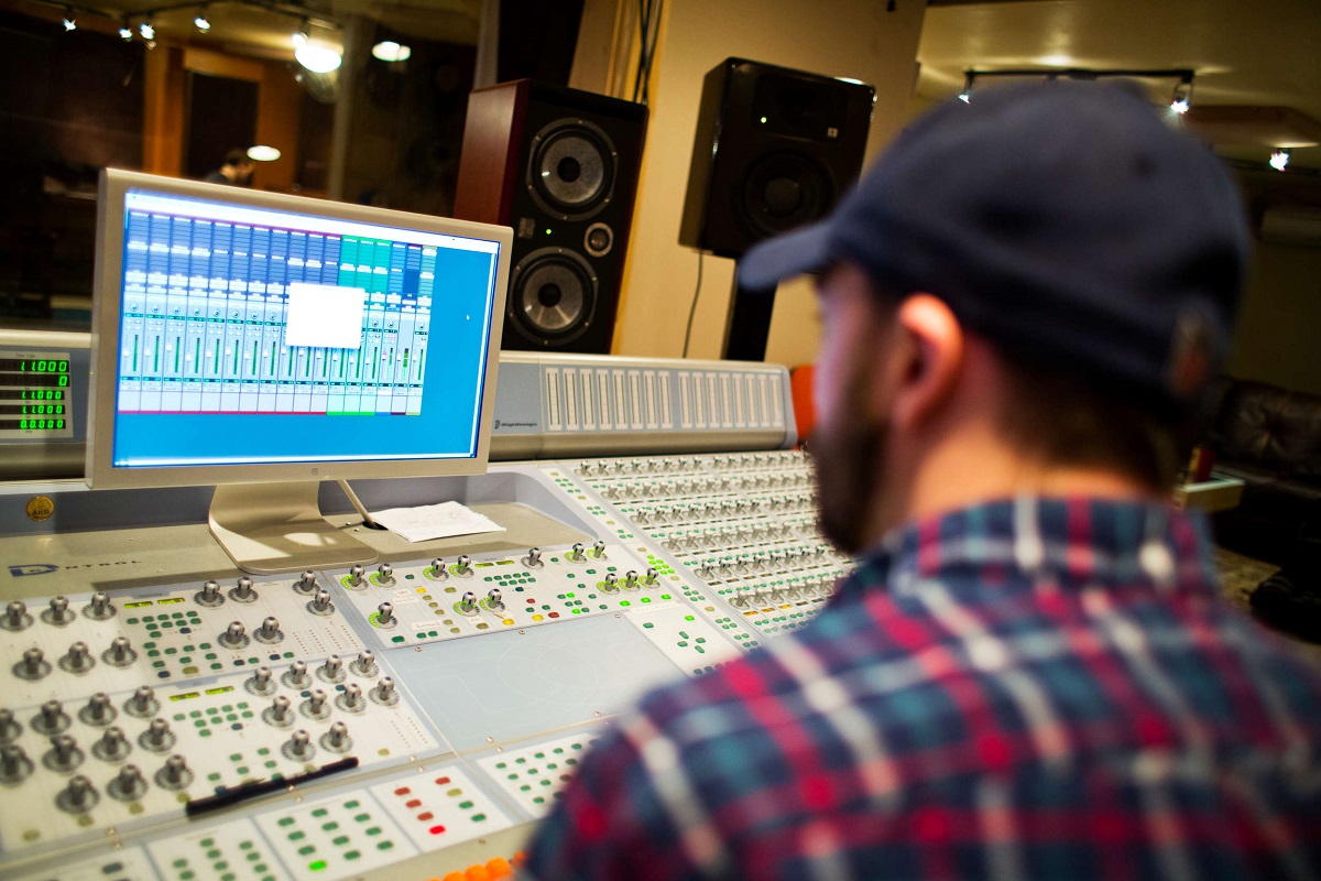 Co-instructor Bo Bodnar works at a mixing board.
