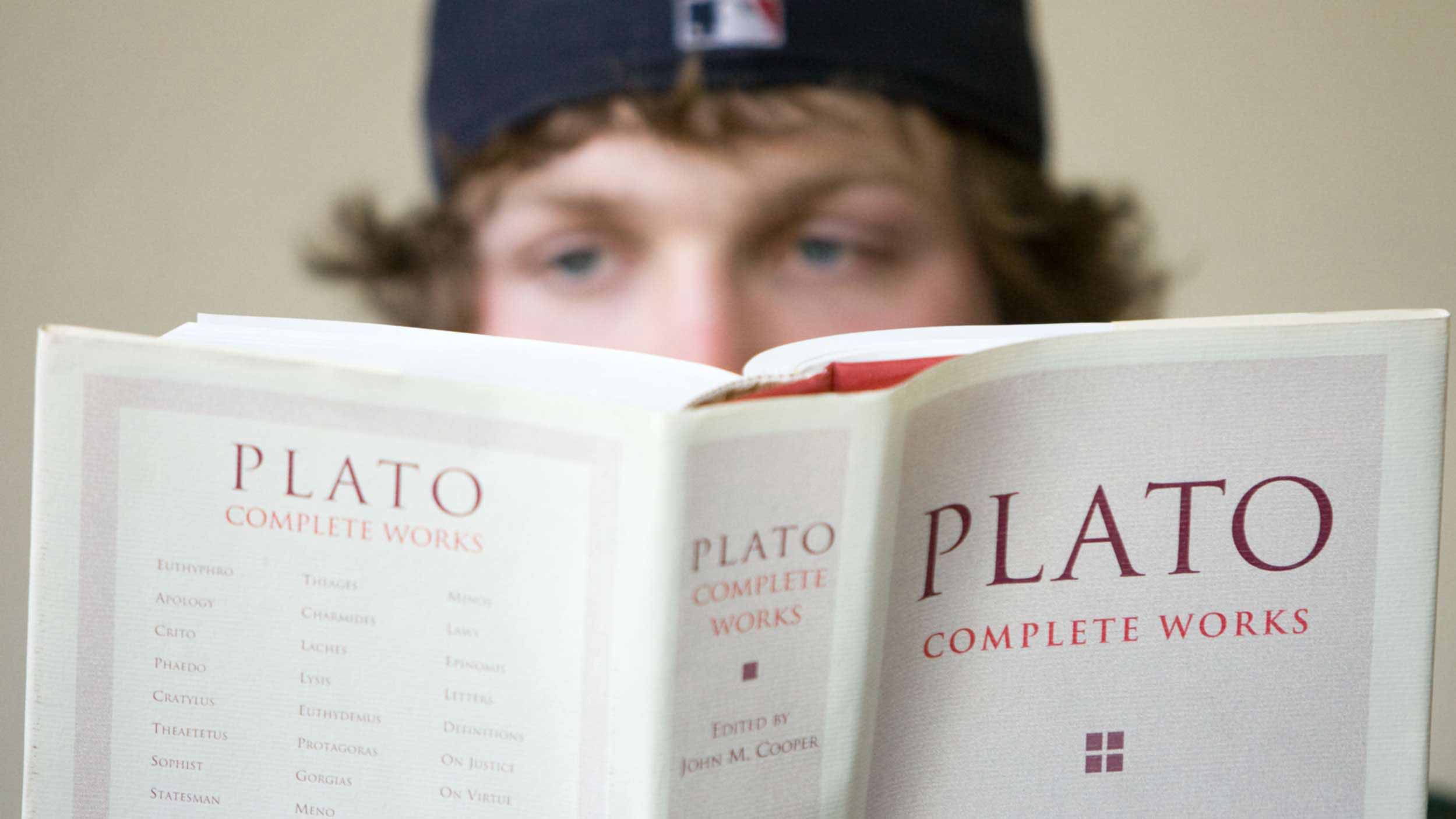 A philosophy student reads Plato