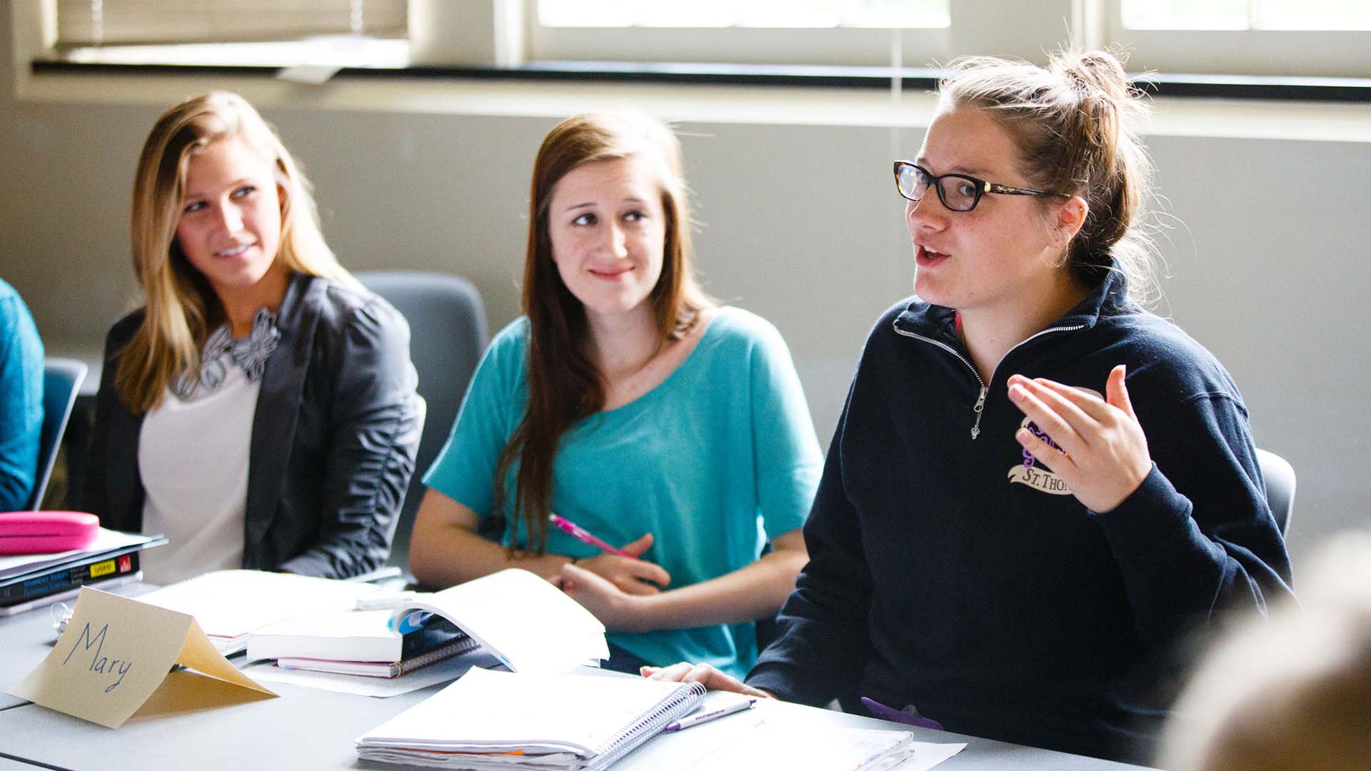 Students talk during a Women's Studies class