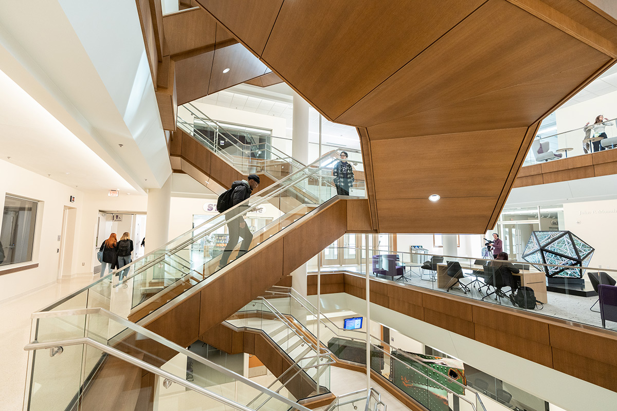 Students on the grand stairway in the Schoenecker Center