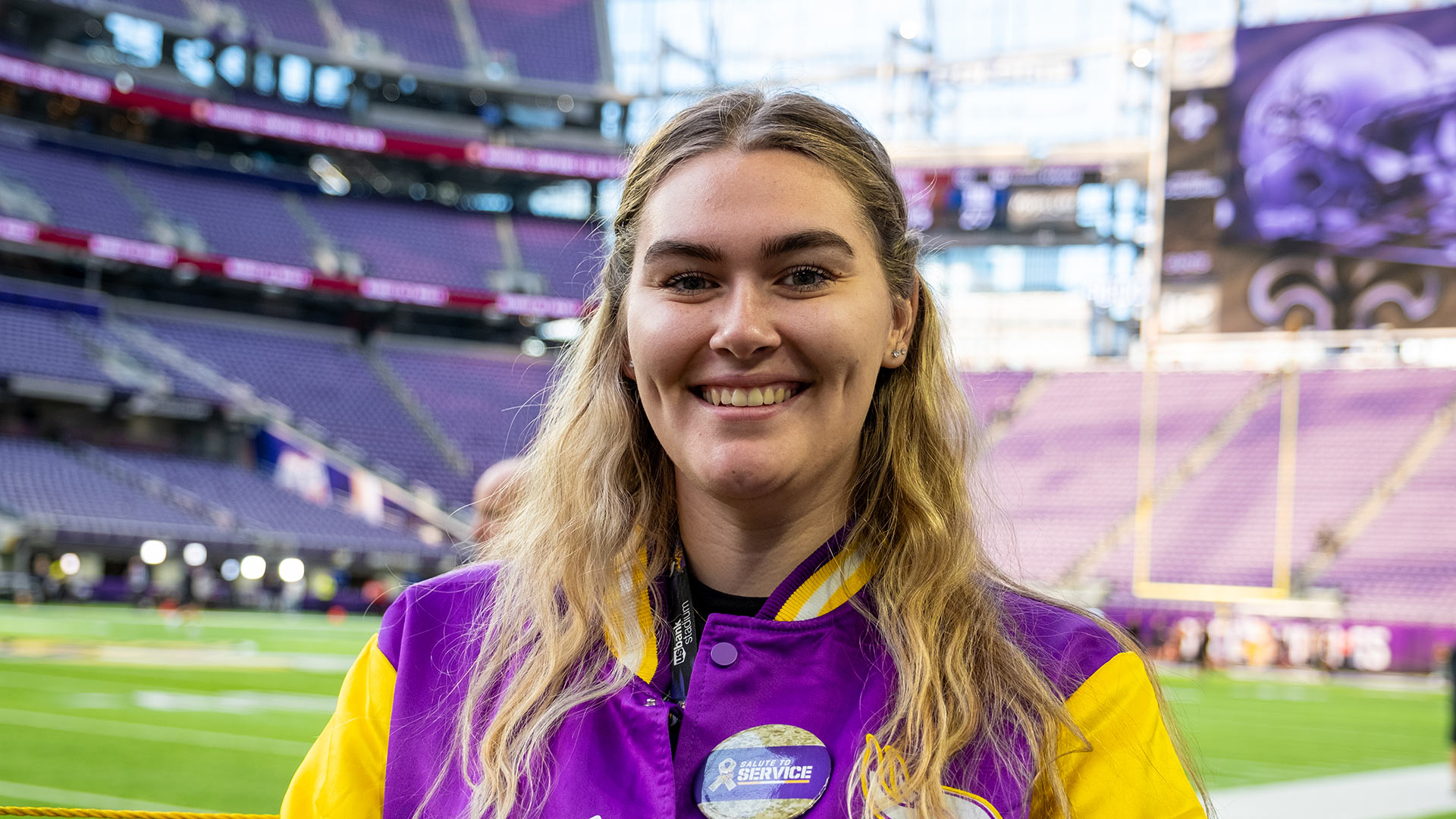 St. Thomas student Morgan on the field at U.S. Bank Stadium during her internship with the Minnesota Vikings
