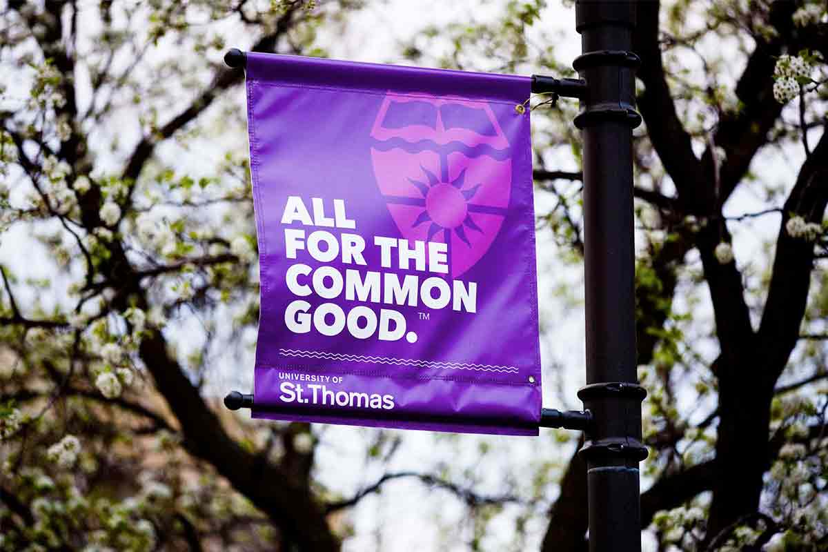 A sign reading "All for the Common Good" 