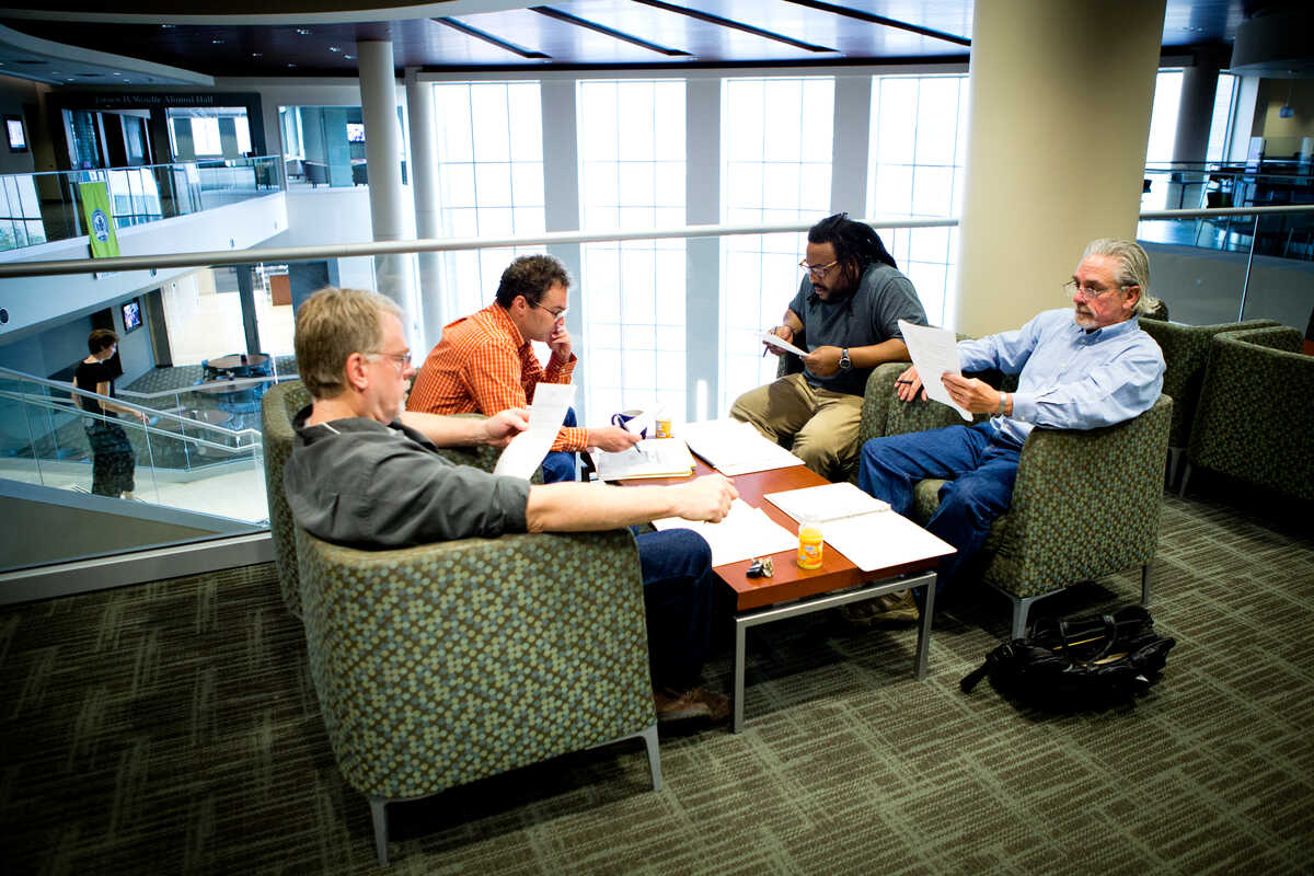 Group of faculty deep in thought
