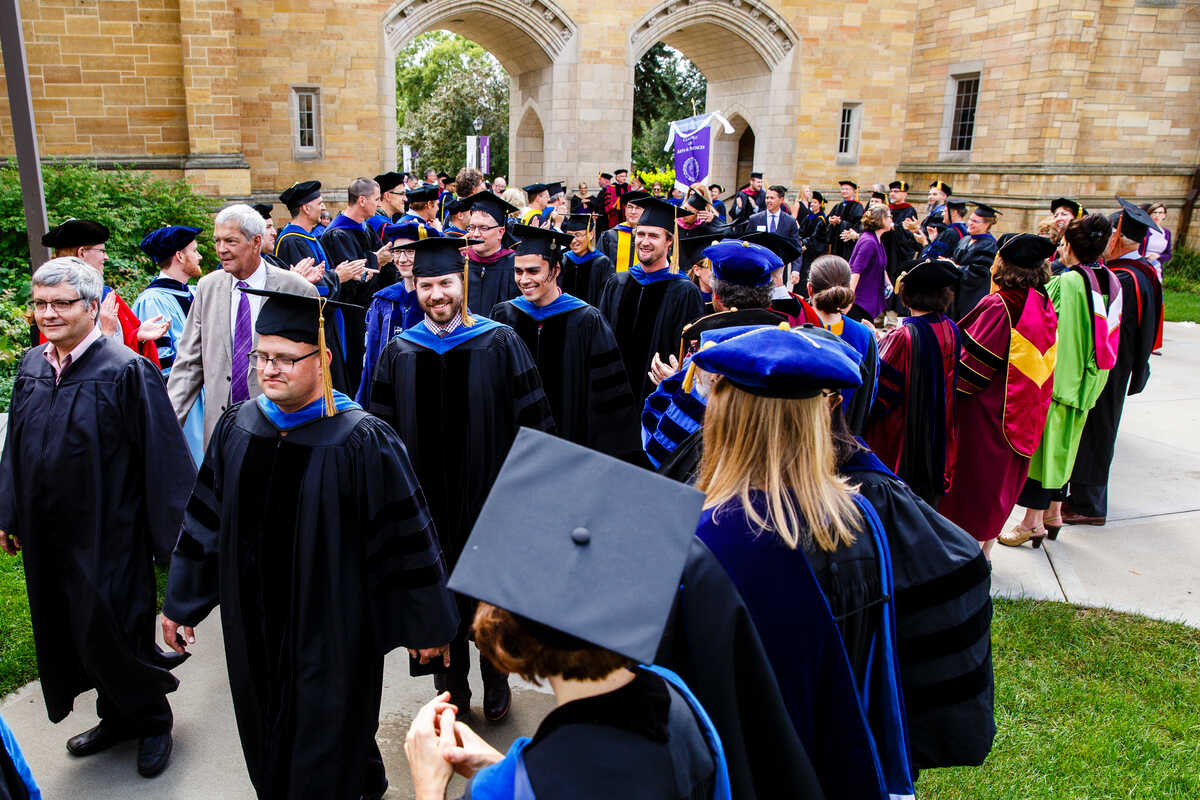 Faculty processing outside Aquinas Hall