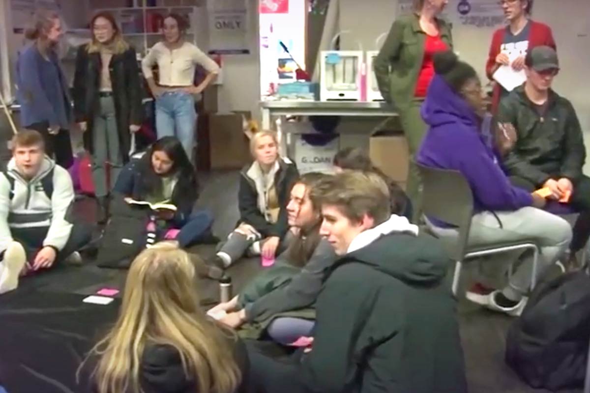 Students sitting on floor