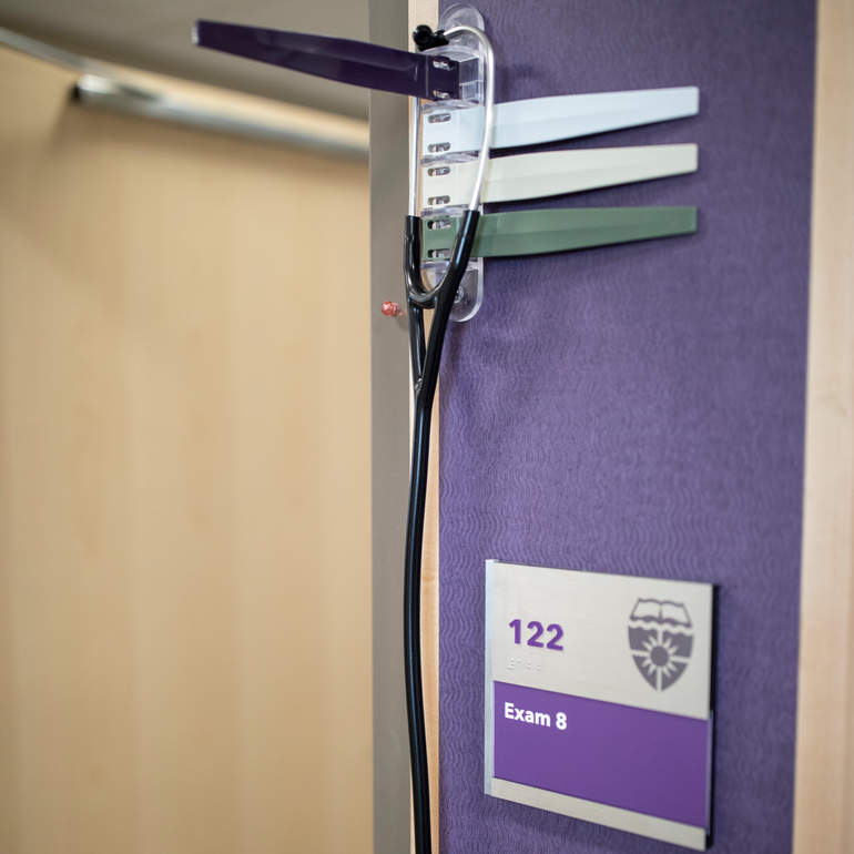 Exam room door with stethoscope hanging 