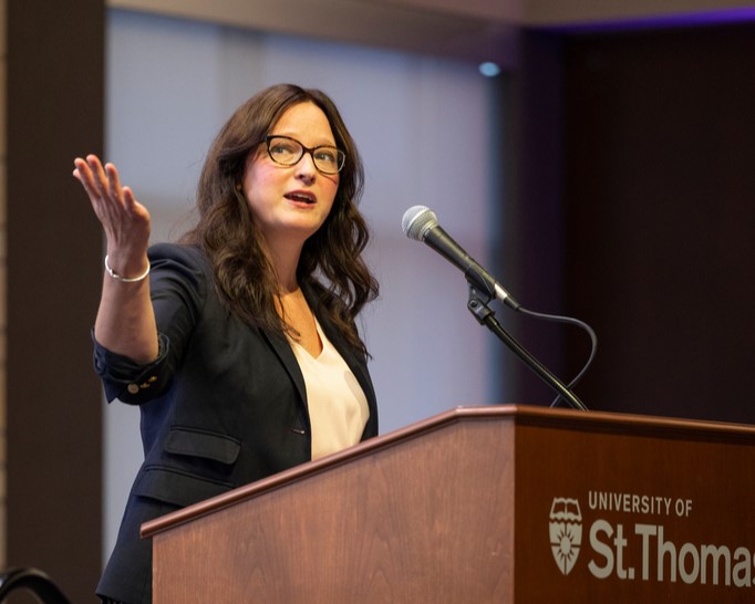 speaker gesturing with their arm