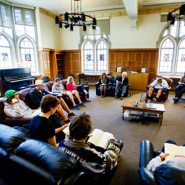 Students at a poetry reading event in the O'Shaughnessy-Frey Library