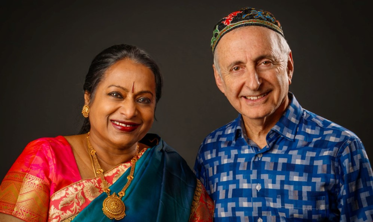 Photo of Nirmala Rajasekar smiling next to David Jordan Harris