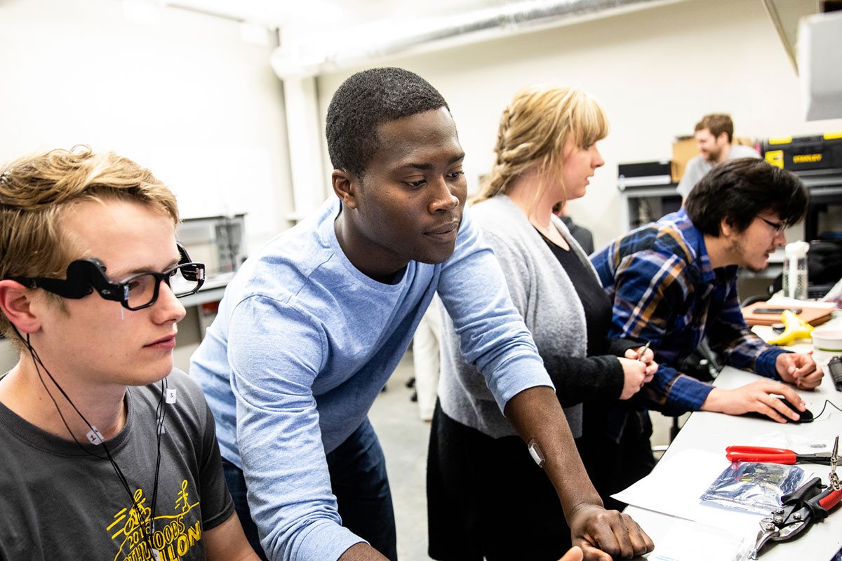 Engineering students work on a research project together.