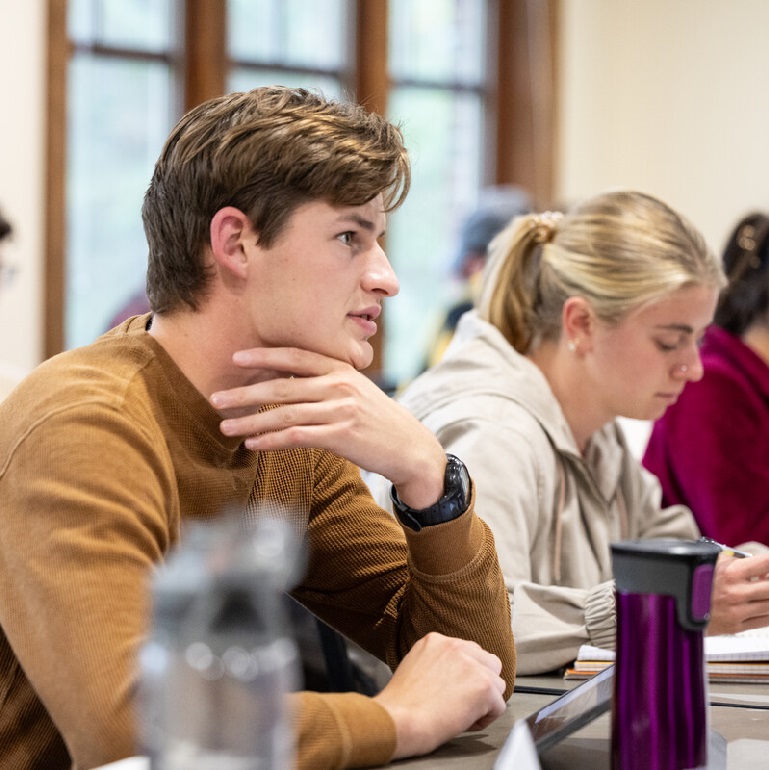Engineering students listen in the classroom.