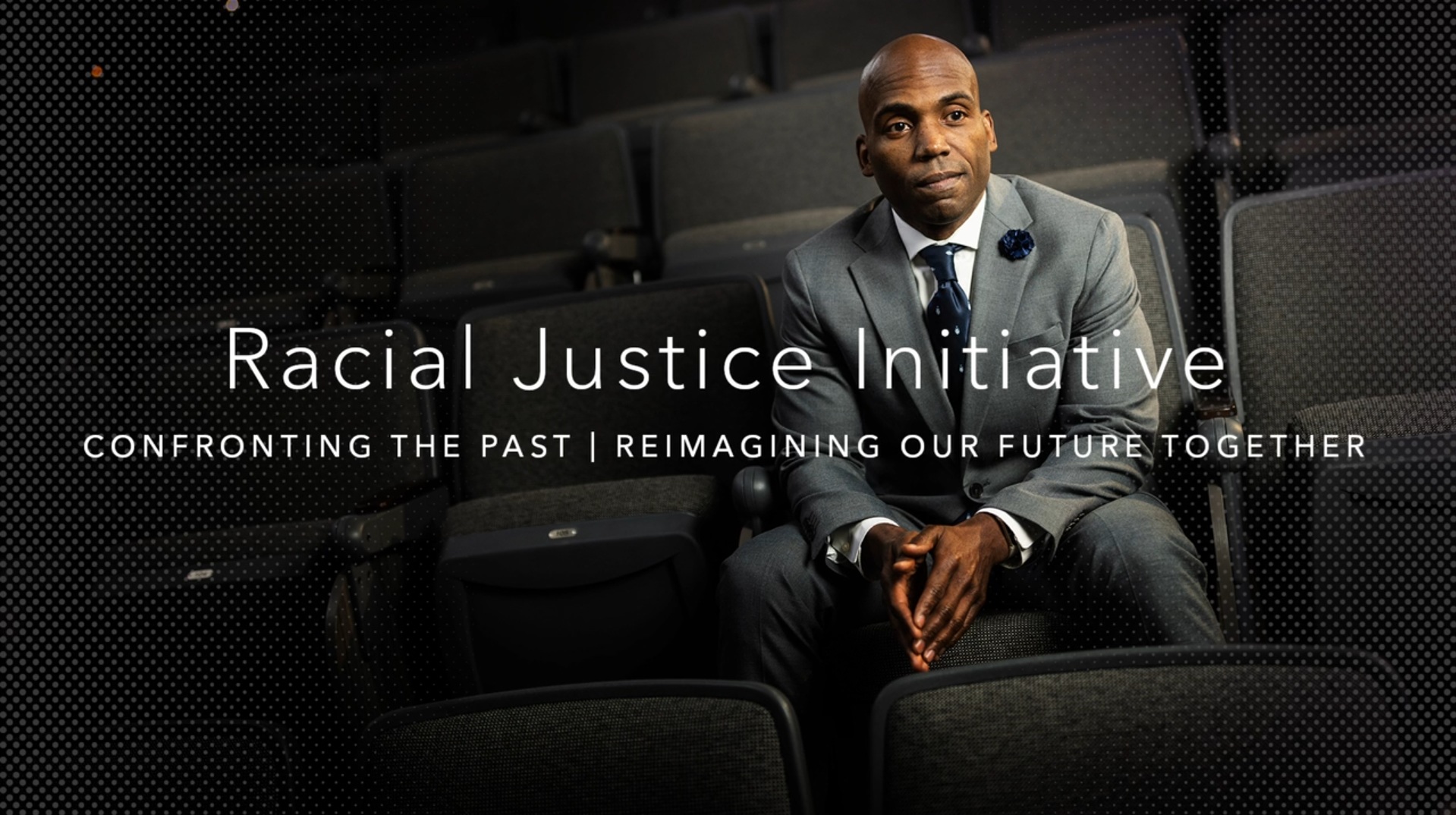 Dr. Yohuru Williams Sitting in an Auditorium