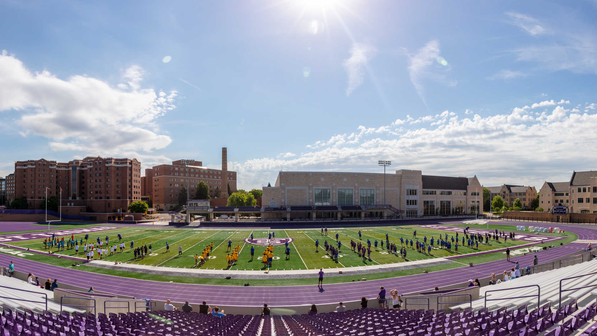 camp attendees participate in drills at the O'Shaughnessy Stadium