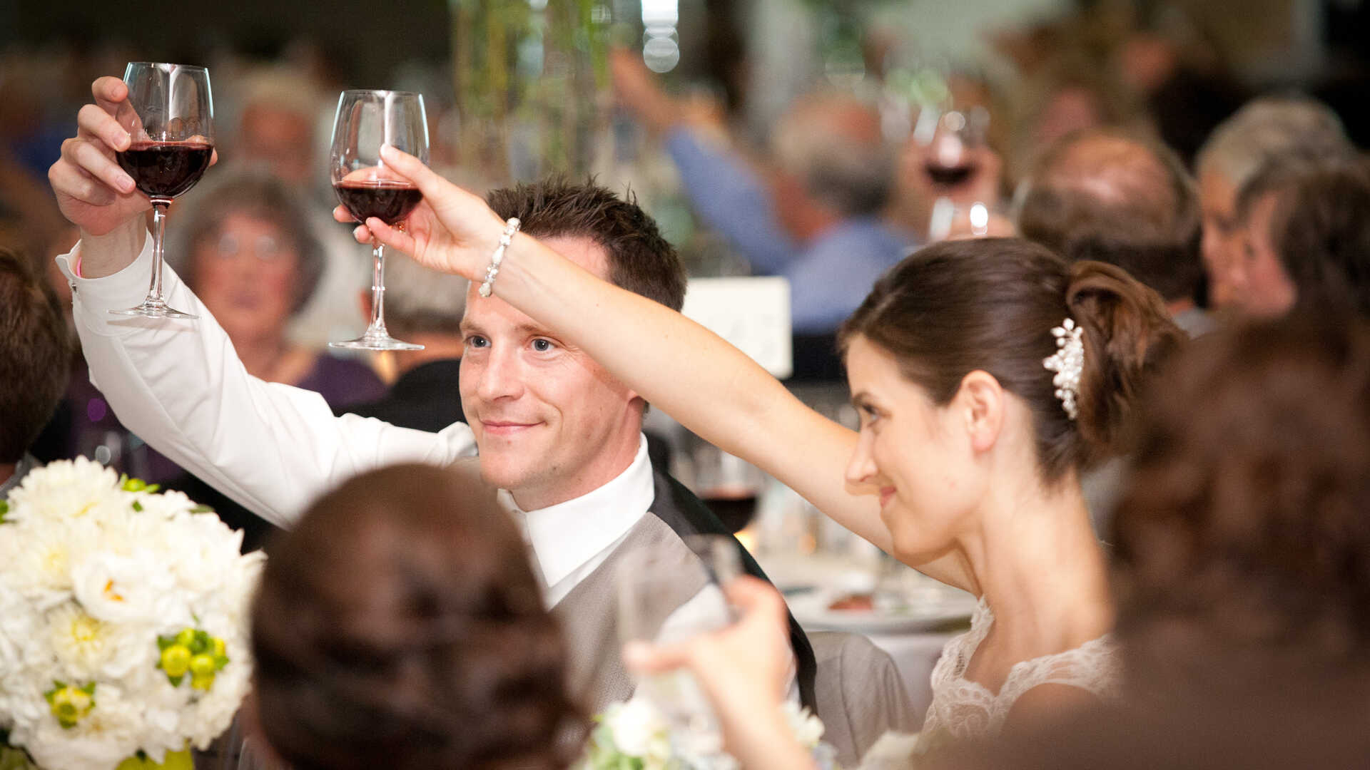 Bride and groom toasting at a wedding reception