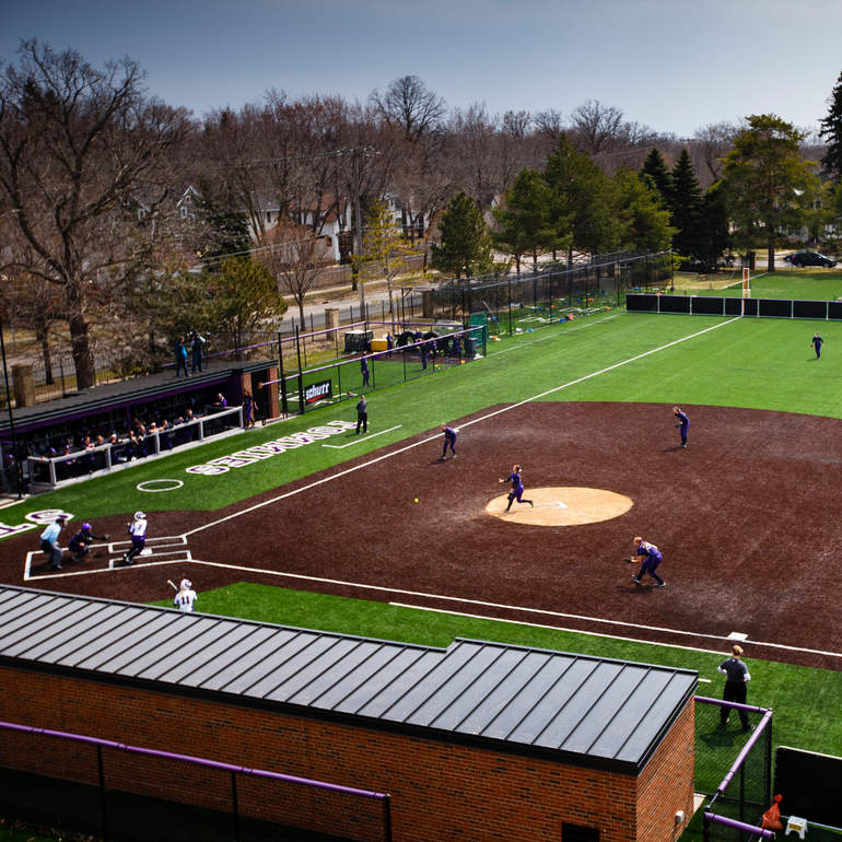 Students playing baseball in South Athletic Field