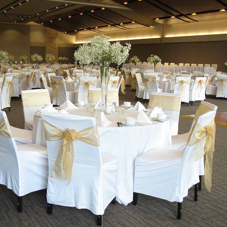 wedding reception chair and tables in white linens