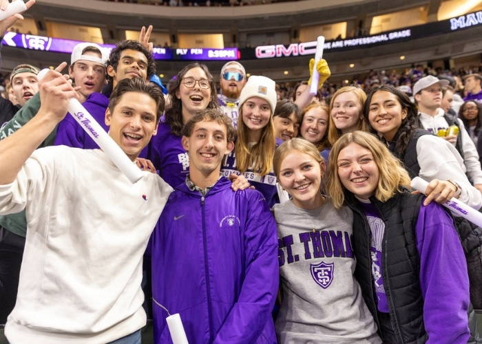 students in the Lee and Penny Anderson arena at a sporting event