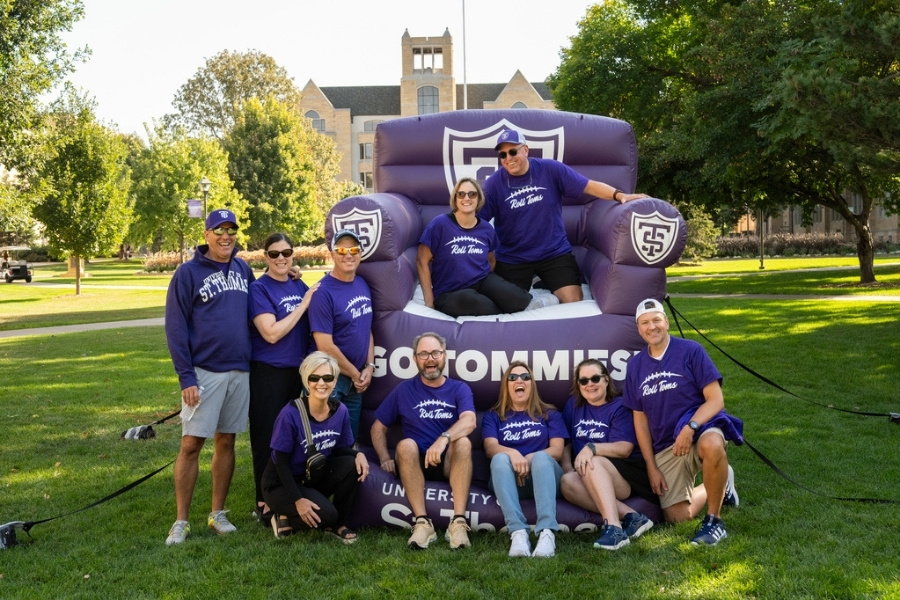 A group of people gathered at St. Thomas homecoming