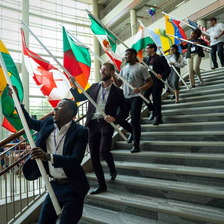 International Students carry flags