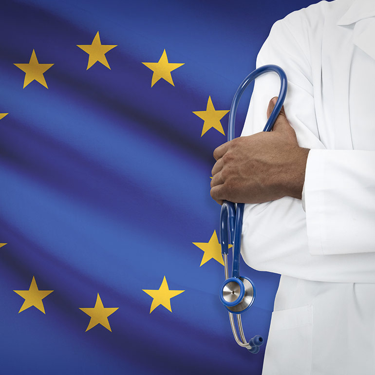 Doctor in front of EU Flag