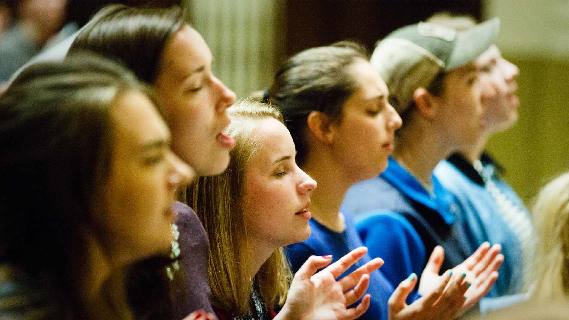 Students singing at worship